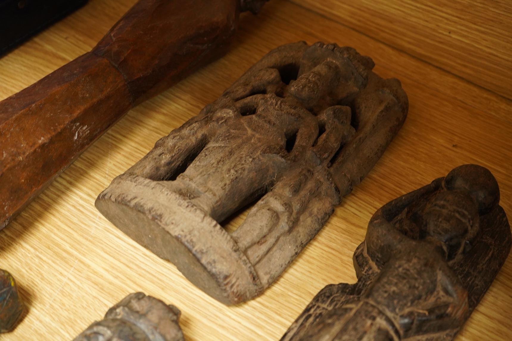 A group of Indian carved figures of deities, largest 42.5cm